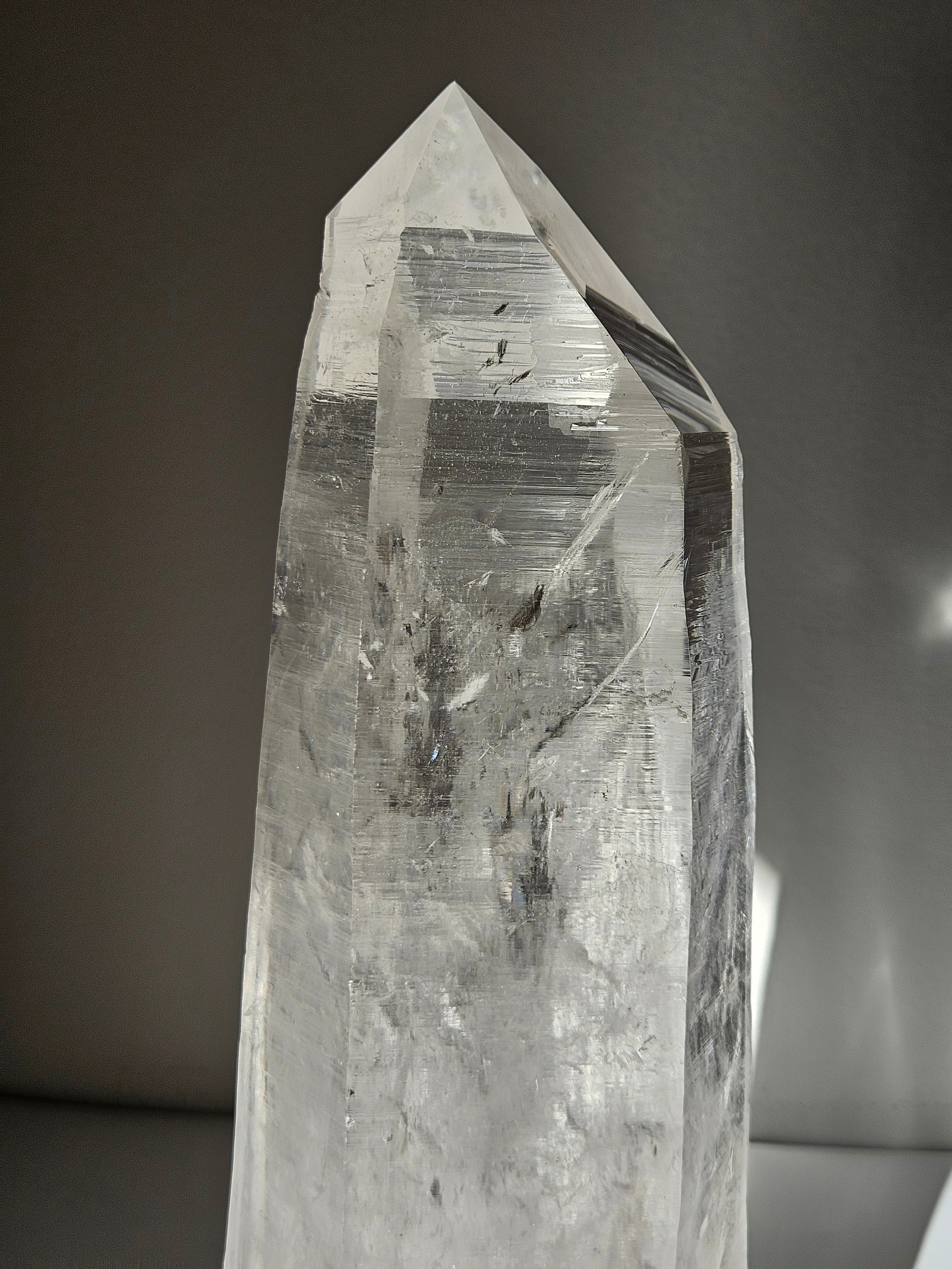 Semipolished Lemurian Point on Spinning Stand