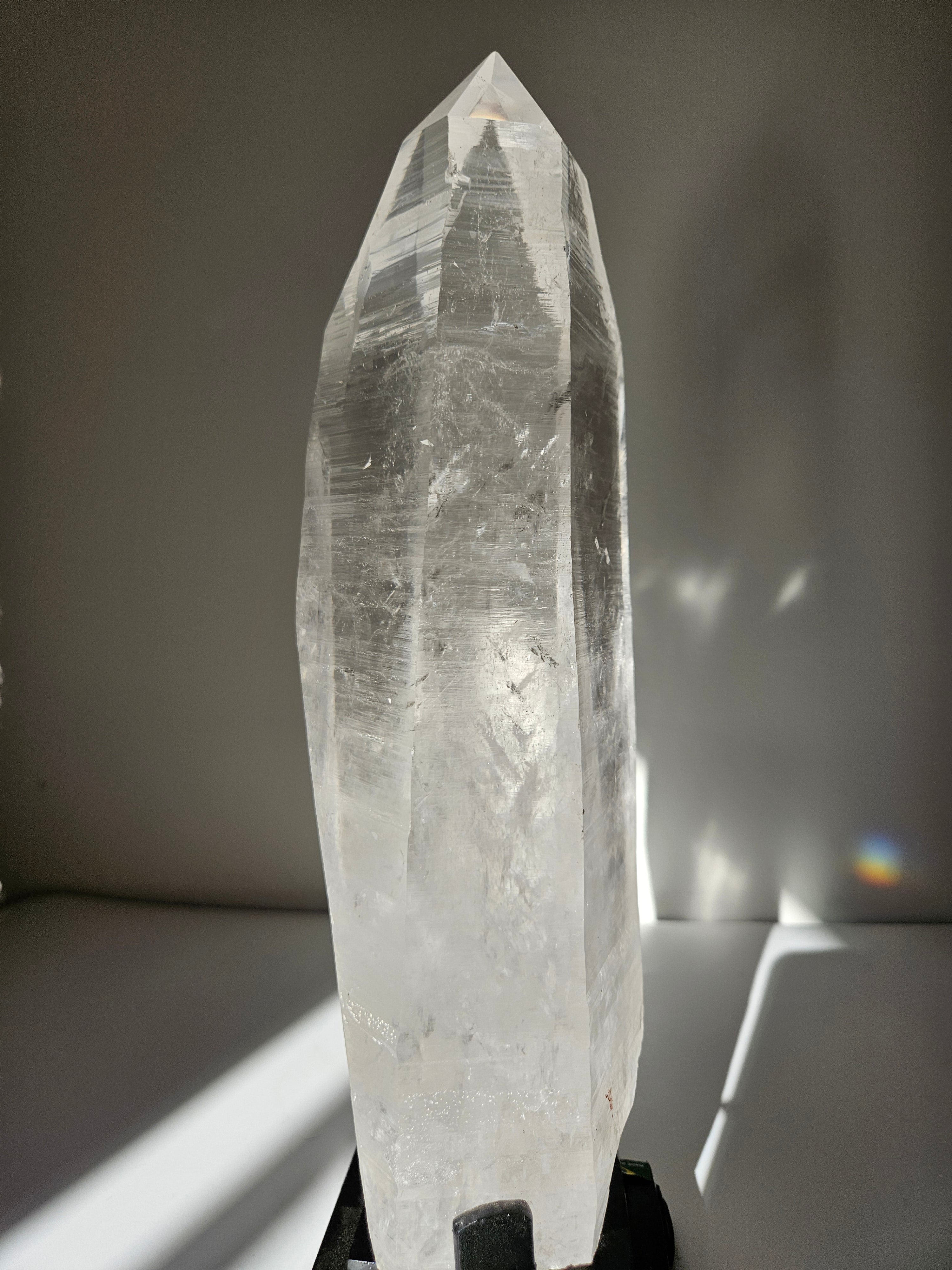 Semipolished Lemurian Point on Spinning Stand