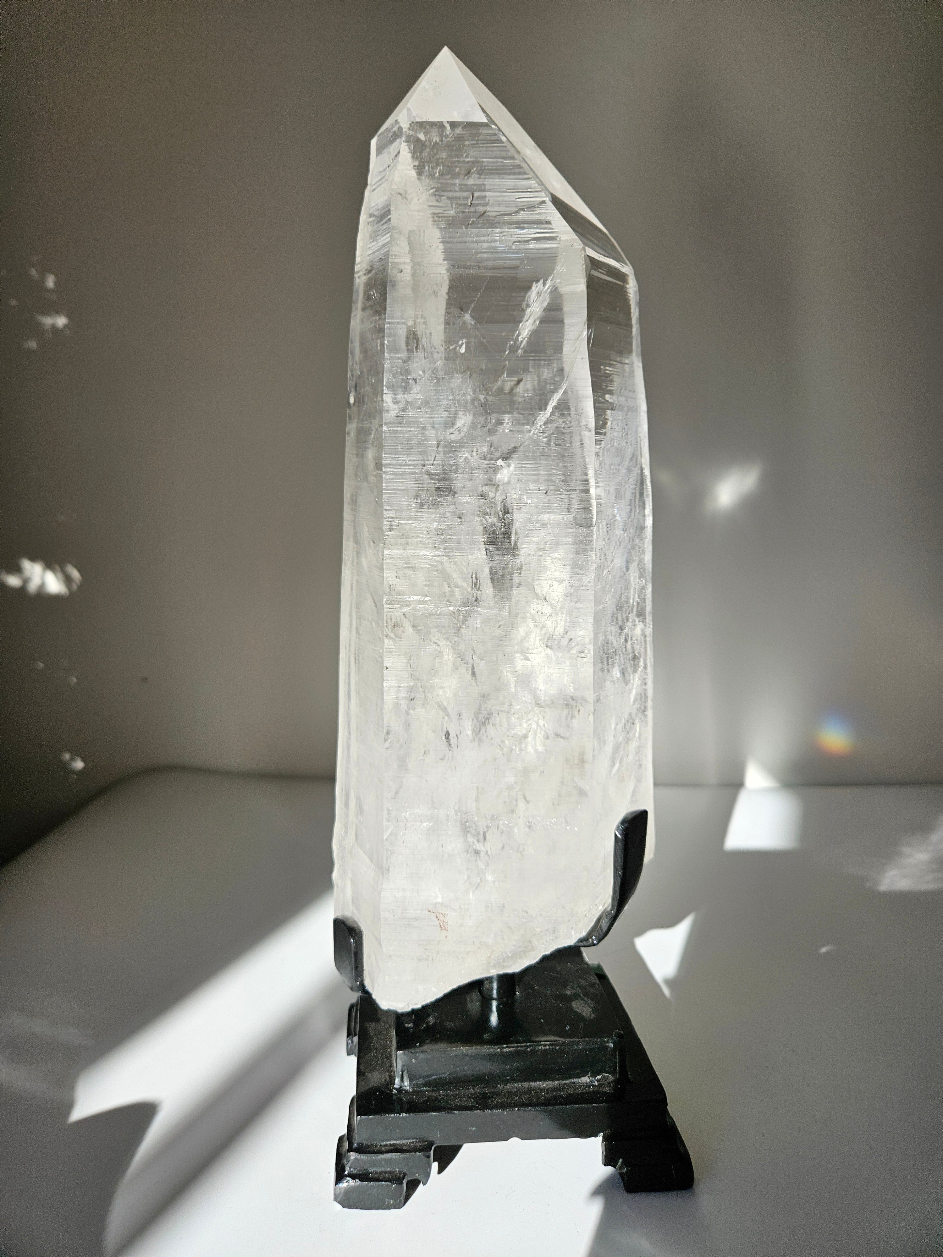Semipolished Lemurian Point on Spinning Stand