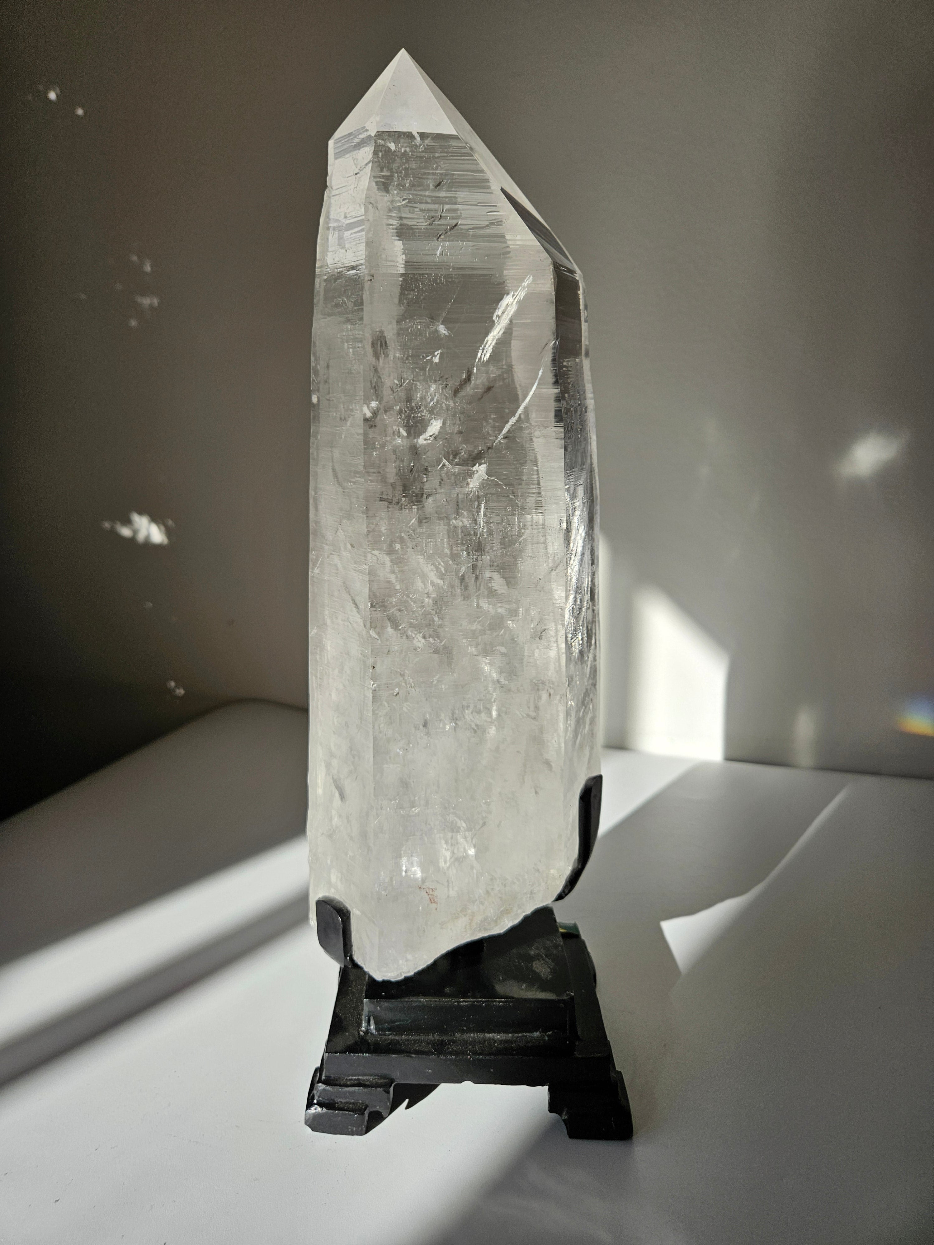 Semipolished Lemurian Point on Spinning Stand
