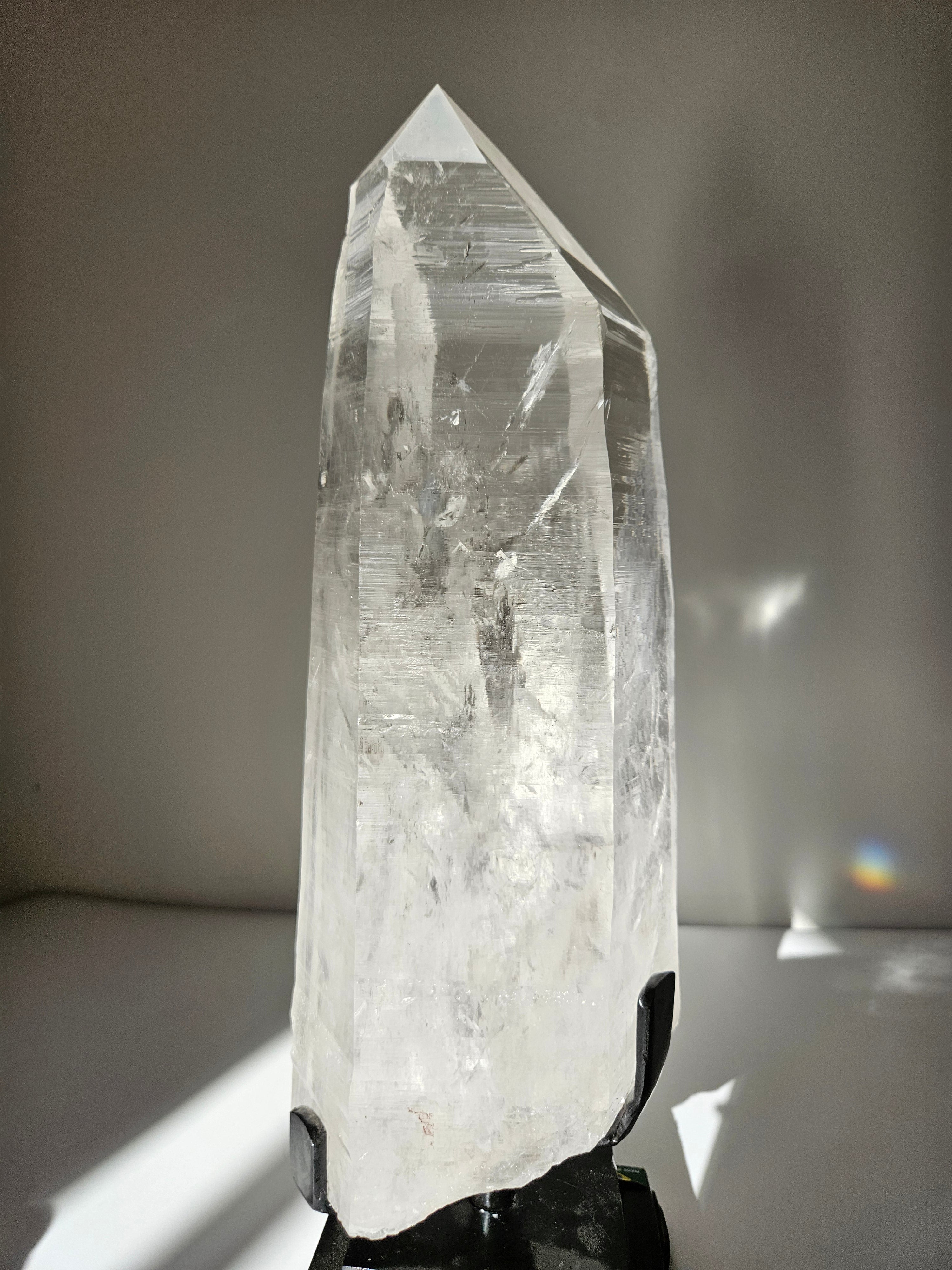 Semipolished Lemurian Point on Spinning Stand